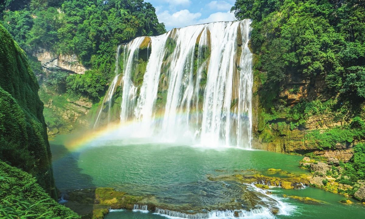 A rainbow is framed with a waterfall at the Huangguoshu Waterfall in Anshun, Southwest China's Guizhou Province on August 28, 2022. Photo: IC
