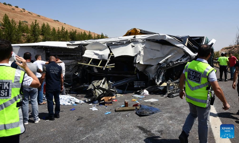 People work at the site of a traffic accident on a highway in Gaziantep province, Türkiye, on Aug. 20, 2022.Photo:Xinhua