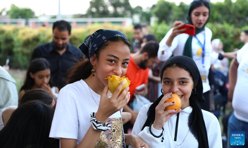 Children taste mangoes during a mango festival in Ismailia province, Egypt, on Aug. 19, 2022.Photo:Xinhua