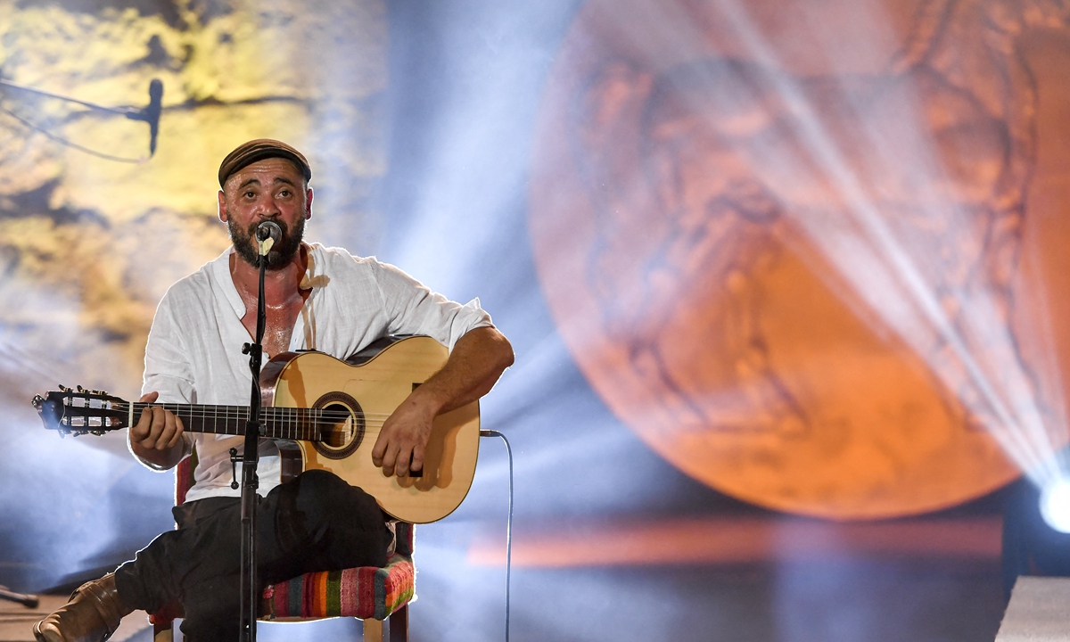 Algerian singer Nedjim Bouizzoul performs at the Roman theater of Carthage during the 56th edition of the International Festival of Carthage on August 5, 2022. Photos: AFP Algerian singer Amazigh Kateb performs at the Roman theater of Carthage on August 5, 2022.