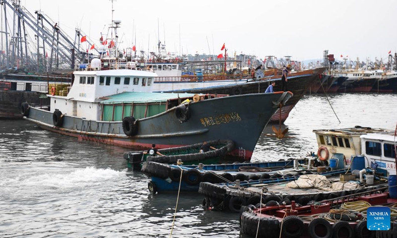 A fishing boat berths in a port for shelter in Yangjiang City, south China's Guangdong Province, Aug. 24, 2022. China on Wednesday activated a Level-IV emergency response to possible geological disasters triggered by Typhoon Ma-on, according to the Ministry of Natural Resources.(Photo: Xinhua)