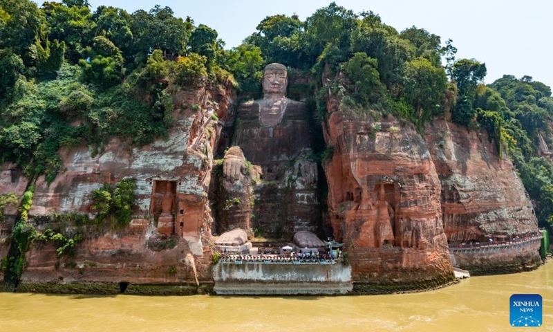 Aerial photo taken on Aug. 23, 2022 shows the Leshan Giant Buddha in southwest China's Sichuan Province. Facing the confluence of the Minjiang, Dadu and Qingyi rivers which saw the decrease of water level in recent days due to continuous high temperature, the base of the Leshan Giant Buddha became exposed above the water.(Photo: Xinhua)