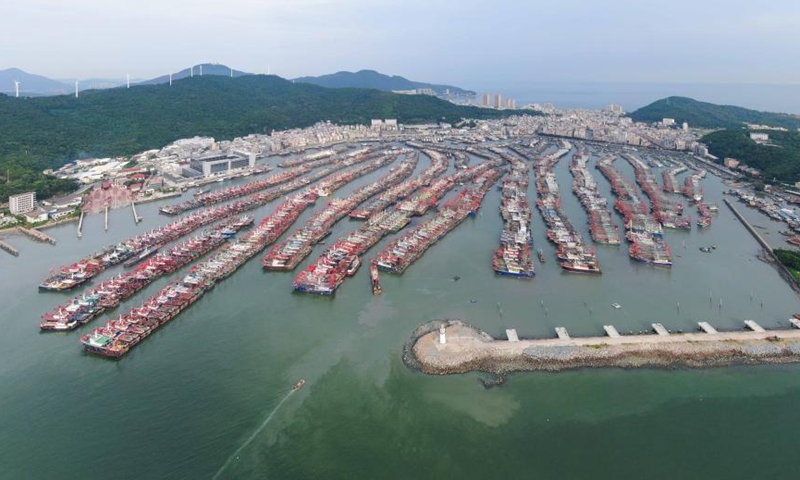 In this aerial photo, fishing boats have returned to a port for shelter in Yangjiang City, south China's Guangdong Province, Aug. 24, 2022. China on Wednesday activated a Level-IV emergency response to possible geological disasters triggered by Typhoon Ma-on, according to the Ministry of Natural Resources.(Photo: Xinhua)