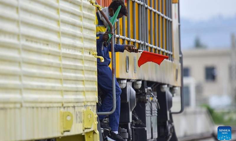 A local employee gets off a freight train of Ethiopia-Djibouti railway at the Indode Freight Station on the outskirts of Addis Ababa, Ethiopia, on Aug. 25, 2022. The Chinese-built Ethiopia-Djibouti railway on Thursday started vehicle shipment from ports in Djibouti to Addis Ababa, the Ethiopian capital. The first vehicle shipment arrived at the Indode Freight Station on the outskirts of Addis Ababa.(Photo: Xinhua)