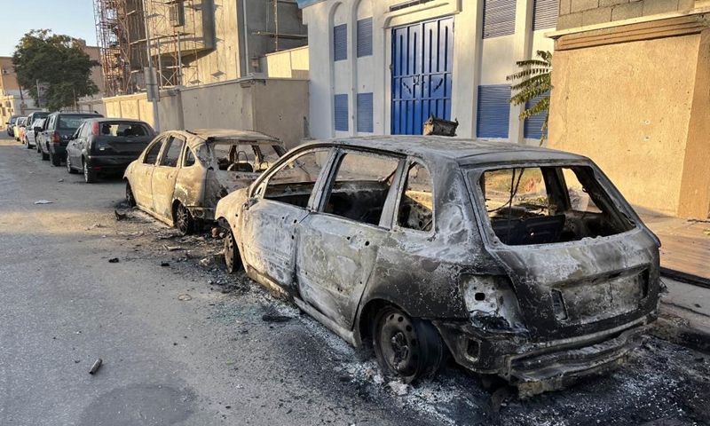 Damaged vehicles are seen after clashes in central Tripoli, Libya, on Aug. 27, 2022.Photo:Xinhua