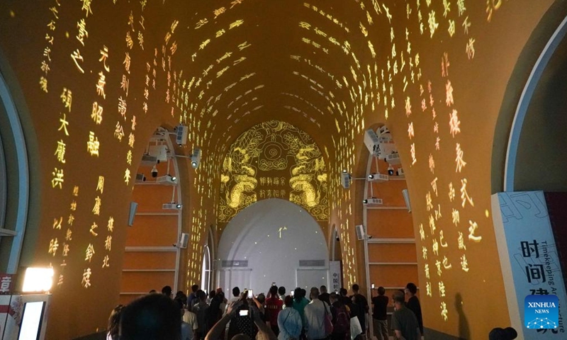 People visit an exhibition at the ground floor of Gulou, a historic drum tower, in Beijing, capital of China, Aug 28, 2022.Photo:Xinhua