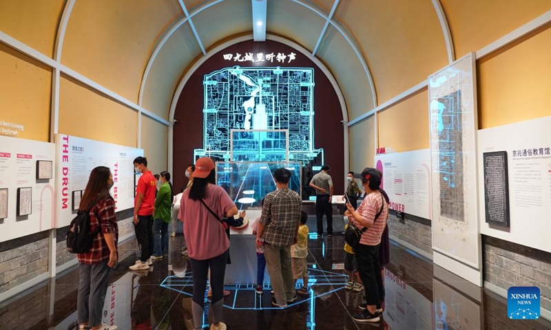 People visit an exhibition at the ground floor of Gulou, a historic drum tower, in Beijing, capital of China, Aug 28, 2022.Photo:Xinhua