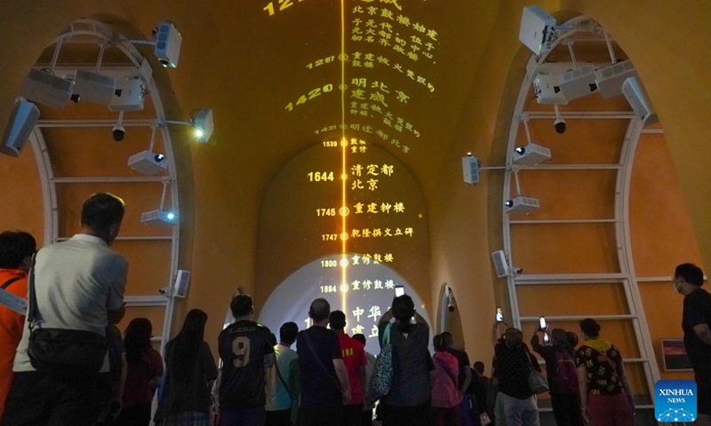 People visit an exhibition at the ground floor of Gulou, a historic drum tower, in Beijing, capital of China, Aug 28, 2022.Photo:Xinhua