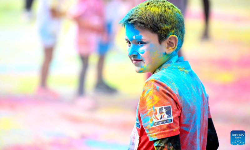 A child reacts during the color run in Skopje, North Macedonia, Sept. 18, 2022. (Photo by Tomislav Georgiev/Xinhua)