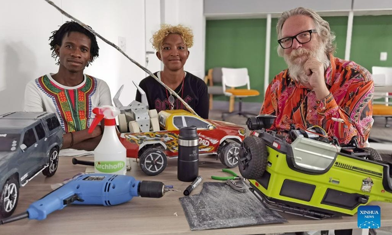 Gideon Katjimba (L), a self-taught engineer at Kunene General Company, is seen with representatives from the Future Lab Technology at the University of Namibia in Windhoek, Namibia, on Aug. 30, 2022. Young street engineers from Opuwo town in Kunene region, north-western Namibia, are integrating robotics into hand-made toy cars to capture new business opportunities.(Photo: Xinhua)