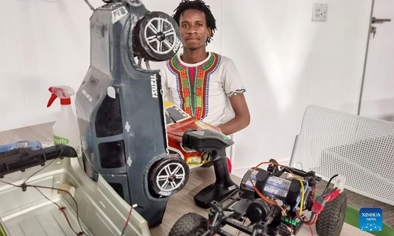 Gideon Katjimba, a self-taught engineer at Kunene General Company, displays toy cars enhanced with digital features in Windhoek, Namibia, on Aug. 30, 2022. Young street engineers from Opuwo town in Kunene region, north-western Namibia, are integrating robotics into hand-made toy cars to capture new business opportunities.(Photo: Xinhua)