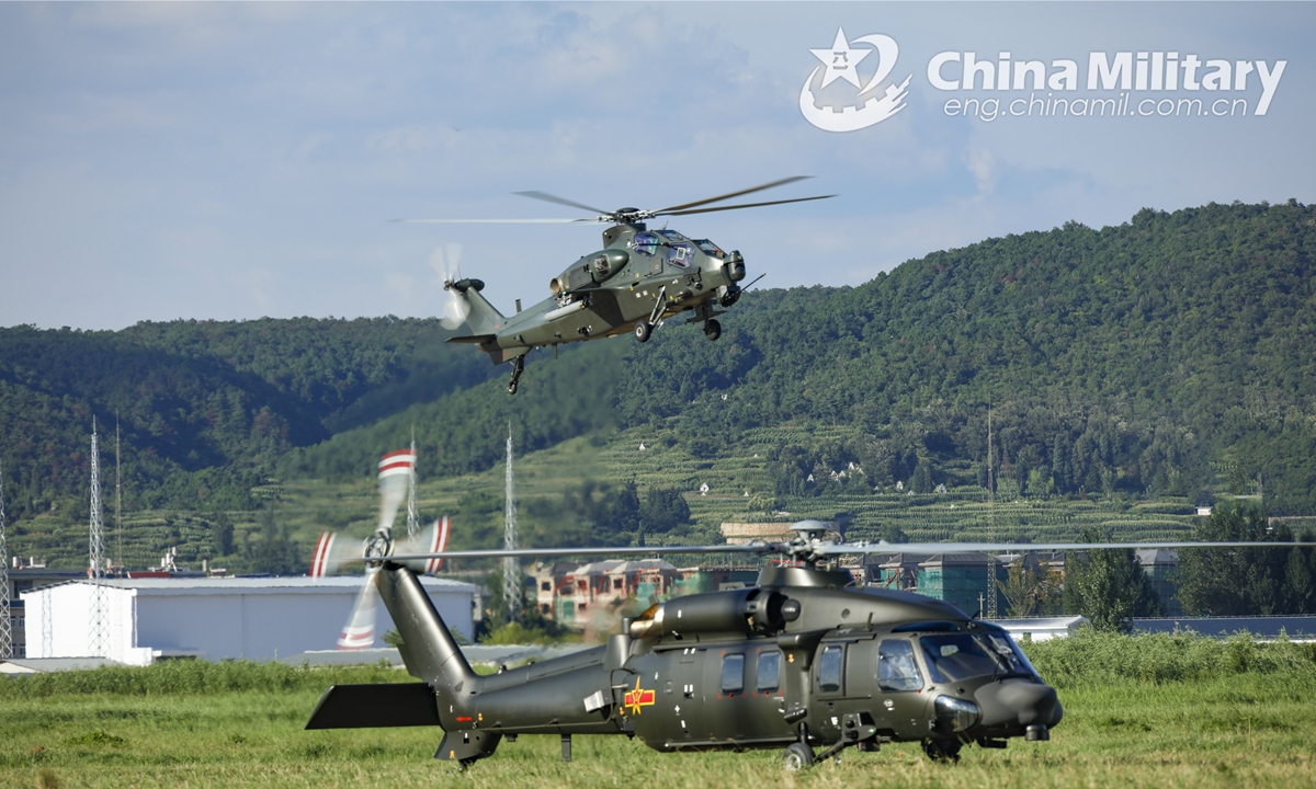 Helicopters attached to a brigade under the PLA 75th Group Army successively take off in a recent real-combat flight training exercise. (eng.chinamil.com.cn/Photo by Sun Changyi)