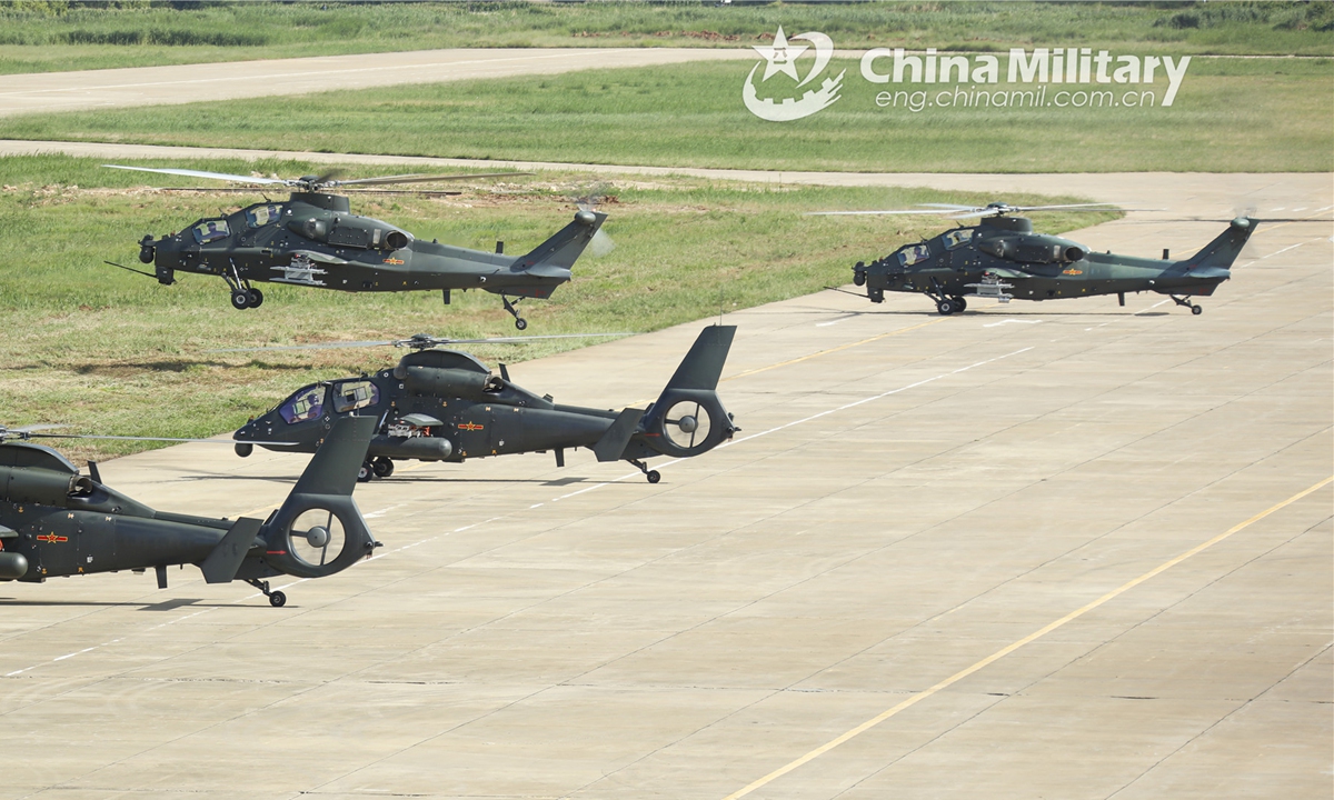 A group of helicopters attached to a brigade under the PLA 75th Group Army successively take off in a recent real-combat flight training exercise. (eng.chinamil.com.cn/Photo by Sun Changyi)
