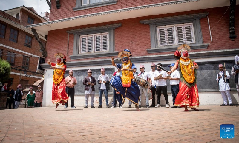 Dancers perform in the street during the Kartik Naach Festival in Lalitpur, Nepal, Sept. 3, 2022.Photo:Xinhua