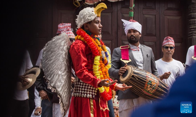 Dancers perform in the street during the Kartik Naach Festival in Lalitpur, Nepal, Sept. 3, 2022.Photo:Xinhua