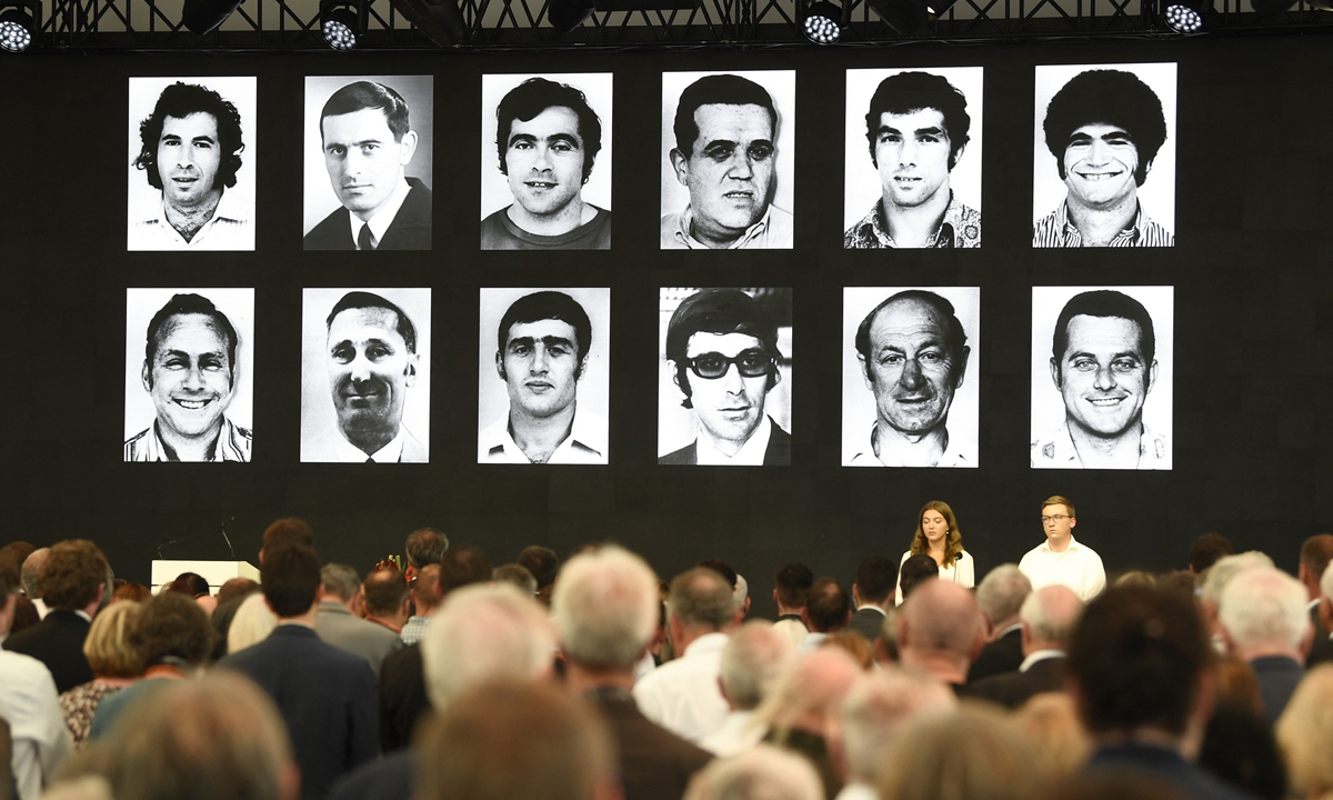 Portraits of the victims are displayed at the end of a ceremony to mark the 50th anniversary of an attack on the 1972 Munich Olympics at the Fuerstenfeldbruck Air Base, Germany on September 5, 2022. German President Frank-Walter Steinmeier sought 