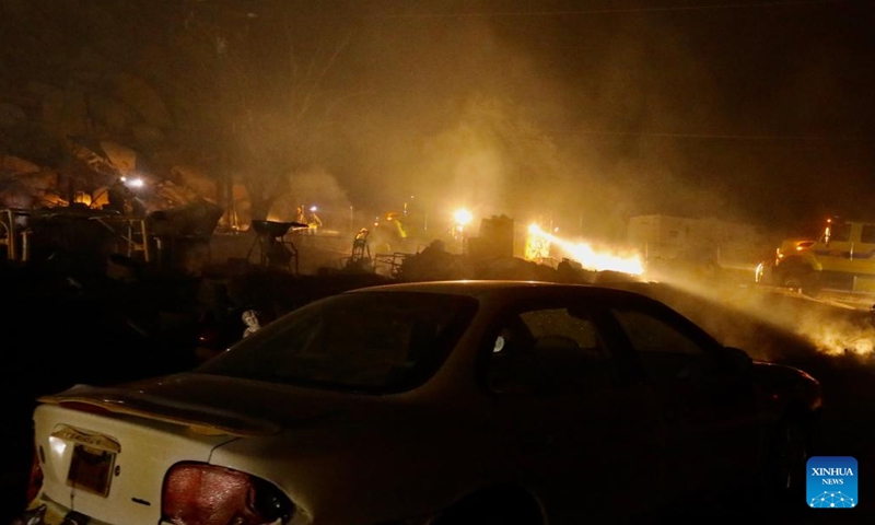 Firefighters battle the fire at a burning property in Hemet, Riverside County, California, the United States, on Sept. 6, 2022. A wildfire in Southern California that killed two people and injured a third has exploded to over 2,400 acres (9.71 square km) within 24 hours as of Tuesday morning, authorities said.(Photo: Xinhua)