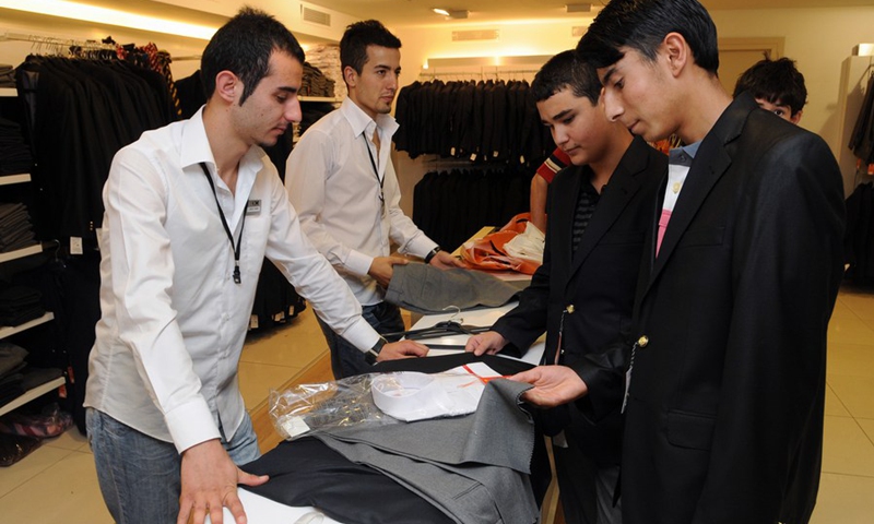 Students are seen in a tailor store in Ankara, Türkiye, on Sept. 6, 2022.(Photo: Xinhua)