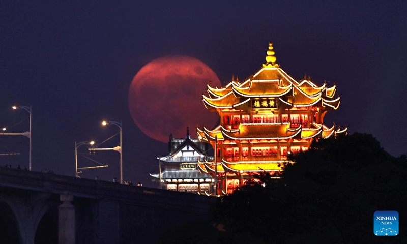 A full moon rises behind Huanghelou, or Yellow Crane Tower, in Wuhan, central China's Hubei Province, Sept. 10, 2022.Photo:Xinhua