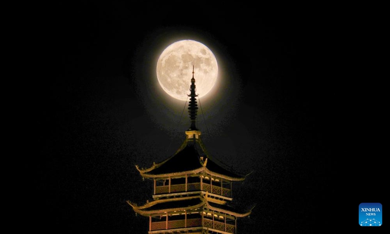 A full moon rises above the Langshan National Forest Park in Nantong, east China's Jiangsu Province, Sept. 10, 2022. The Mid-Autumn Festival falls on Sept. 10 this year.Photo:Xinhua