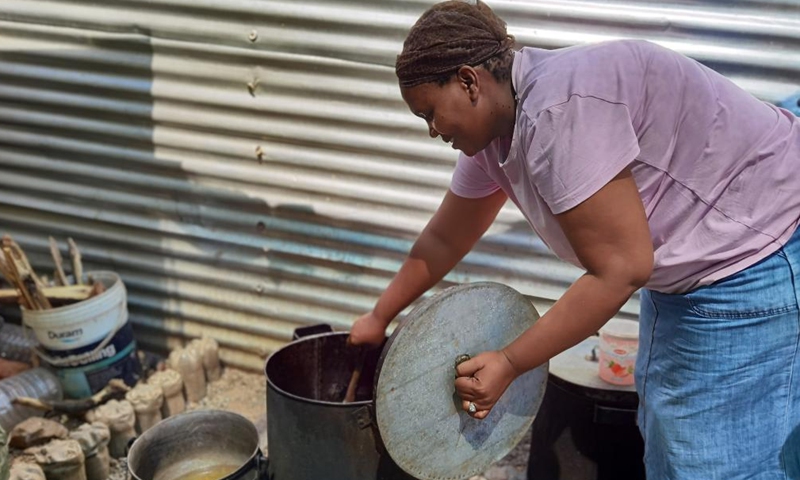 Maria Savage, a founder of Needy Hearts Soup Kitchen, prepares food in Hakahana, an informal settlement in Windhoek, Namibia, on Sept. 12, 2022.Photo:Xinhua