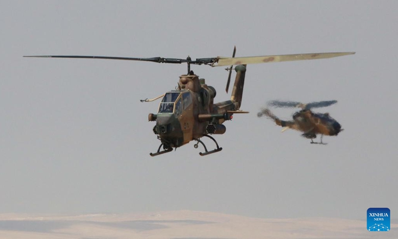 Helicopters take part in the Eager Lion military drill near the city of Zarqa in Jordan, Sept. 14, 2022. The annual Eager Lion military drill hosted by the Jordan Armed Forces kicked off on Sunday in the kingdom with the participation of 26 foreign militaries. More than 4,000 military personnel and 1,000 civilians participated the drill, which runs until Sept. 15, state-run Al-Mamlaka TV reported, citing the drill's spokesman Mustafa Al-Hiyari.(Photo: Xinhua)