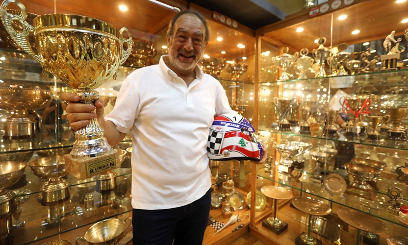 Nabil Karam shows the trophies he won in car races at Billy Karam Museum in Zouk Mosbeh, Lebanon, on Sept. 12, 2022. (Photo: Xinhua)