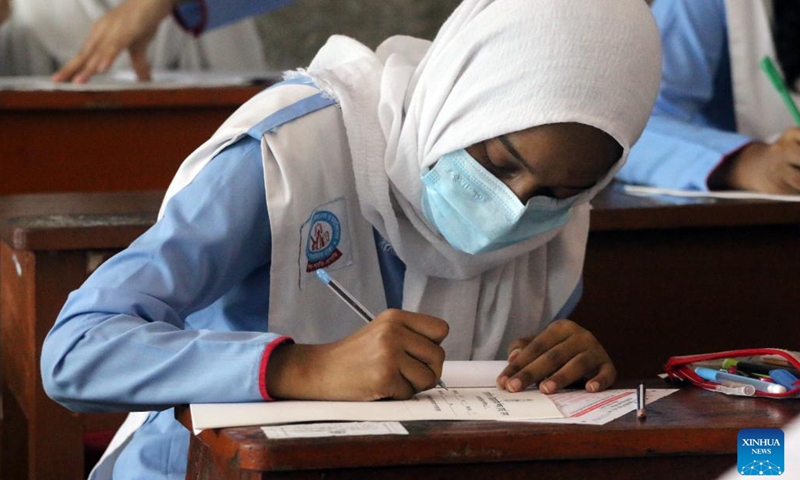 A student takes exam at the Secondary School Certificate (SSC) examination site in Dhaka, Bangladesh on Sept. 15, 2022. Bangladesh's Secondary School Certificate (SSC) and equivalent exams, which are the country's largest public exams for school students, began on Thursday. Over 2 million Bangladeshi students have registered for the SSC and equivalent exams this year, which are considered one of the most important events in the lives of the Bangladeshi students.(Photo: Xinhua)