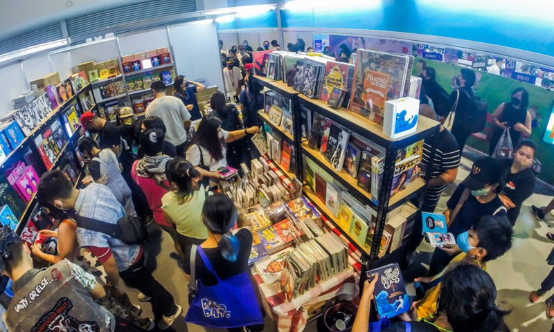 People read books during the Manila International Book Fair in Pasay City, the Philippines, Sept. 18, 2022.Photo:Xinhua