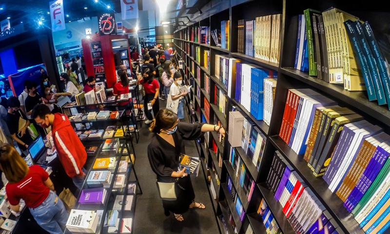 People read books during the Manila International Book Fair in Pasay City, the Philippines, Sept. 18, 2022.Photo:Xinhua