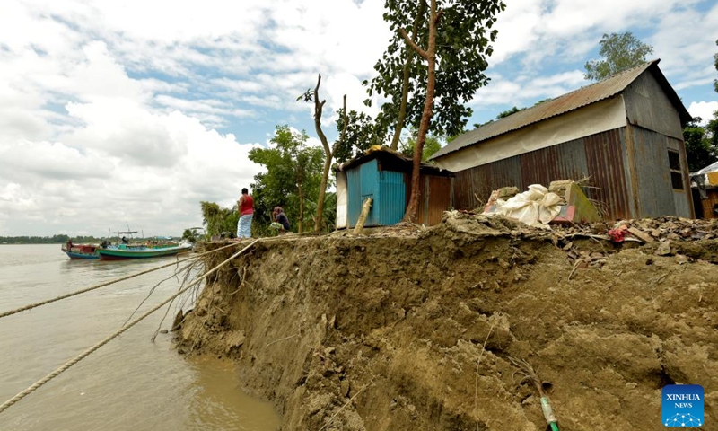 Photo taken on Sept. 19, 2022 shows the eroded river bank in Munshiganj district, Bangladesh. Residents of a village in Munshiganj district have lived amid worries over the last couple of months since Padma river took a serious turn at the start of this monsoon and continued devouring most of the homesteads and vast croplands.(Photo: Xinhua)