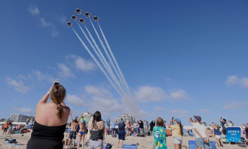 People watch the Pacific Airshow at Huntington Beach, California, the United States on Oct. 1, 2022. The Pacific Airshow, one of the largest airshows in the United States, returned to the skies over Southern California this weekend, featuring demonstrations by military aviators and civilian performers. (Xinhua)