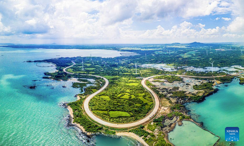 Aerial photo taken on Oct. 6, 2022 shows a view of a scenic coastal highway in Danzhou, south China's Hainan Province. (Xinhua/Pu Xiaoxu)