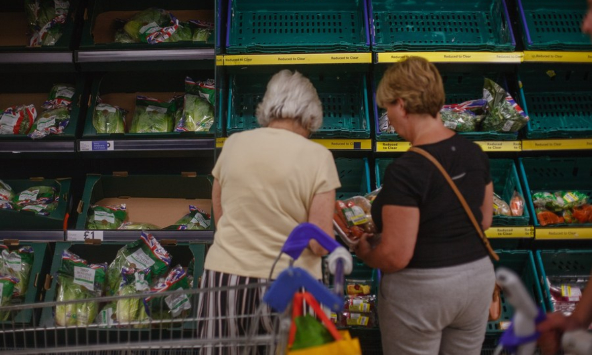 People purchase reduced price goods at a supermarket in Reading, Britain, Aug 21, 2022. Photo:Xinhua