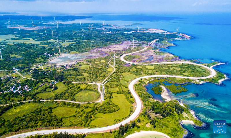 Aerial photo taken on Oct. 6, 2022 shows a view of a scenic coastal highway in Danzhou, south China's Hainan Province. (Xinhua/Pu Xiaoxu)