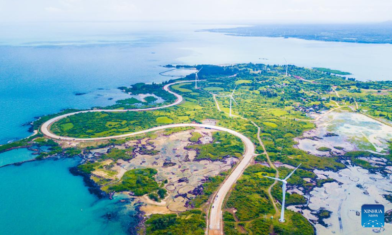 Aerial photo taken on Oct. 6, 2022 shows a view of a scenic coastal highway in Danzhou, south China's Hainan Province. (Xinhua/Pu Xiaoxu)