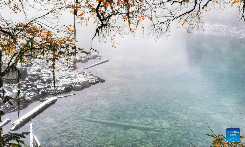 Photo taken on Oct. 7, 2022 shows a view of the Jiuzhaigou scenic area after snow in southwest China's Sichuan Province. (Photo by Liang Feng/Xinhua)