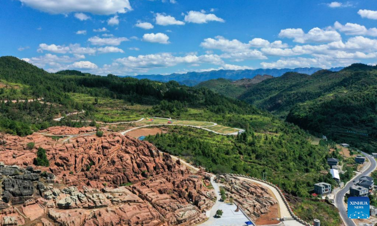 Photo taken on Oct. 3, 2022 shows the view of a red stone forest geopark in Youyang Tujia and Miao Autonomous County, southwest China's Chongqing Municipality. The Youyang red stone forest geopark, which has the karst landform, opened to the public during the National Day holiday. Photo:Xinhua