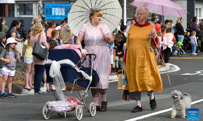 People participate in the Hastings Blossom Parade in Hastings, New Zealand, Sept. 24, 2022.Photo:xinhua