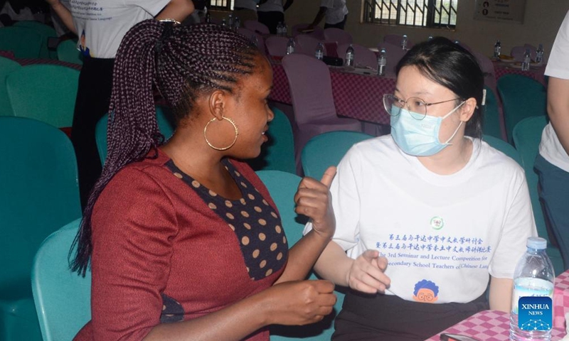 Hilda Ayebare (L), a Ugandan teacher of Chinese language, talks with a Chinese staff member during a capacity-building workshop of local Chinese language teachers at Luyanzi Institute of Technology, Wakiso District, Uganda, Sept. 23, 2022.Photo:Xinhua