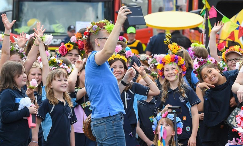 People participate in the Hastings Blossom Parade in Hastings, New Zealand, Sept. 24, 2022.Photo:xinhua