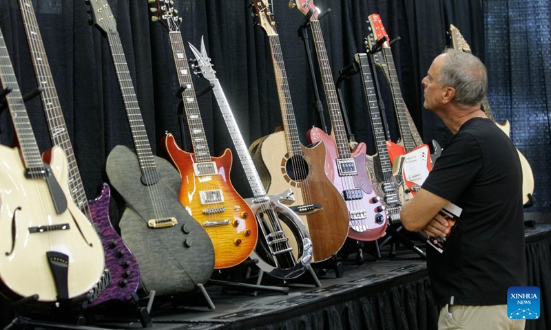 A visitor views guitars at the Vancouver International Guitar Festival in Vancouver, Canada, on Sept. 24, 2022.Photo:Xinhua