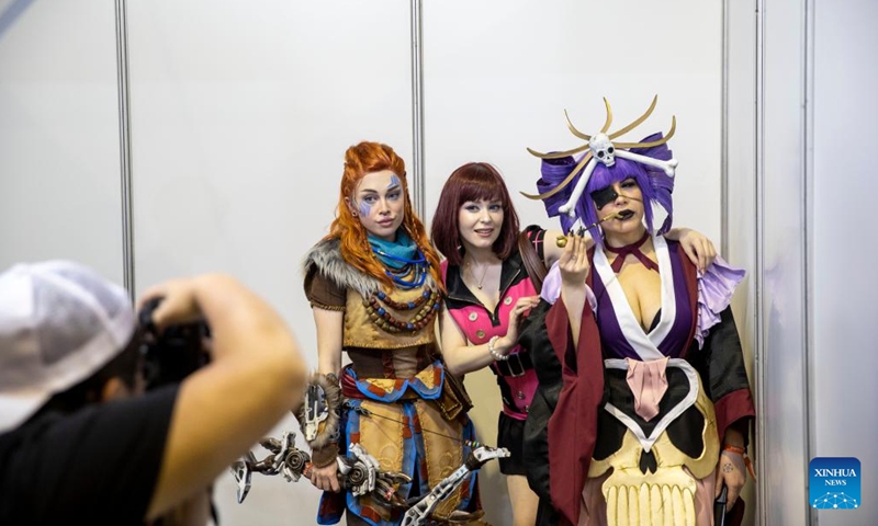 People pose for photos during the Comic Con Africa in Johannesburg, South Africa, on Sept. 25, 2022.Photo:Xinhua