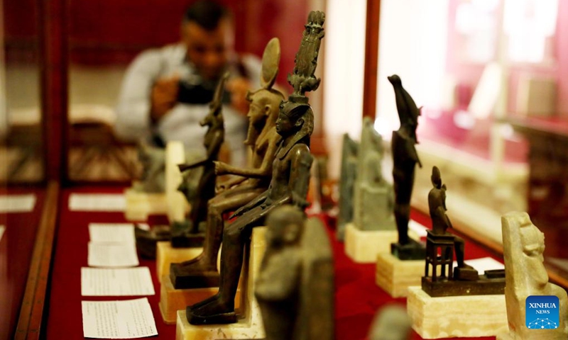 Photo taken on Sept. 27, 2022 shows ancient Egyptian artifacts on display during a temporary exhibition of antiquities at Egyptian Museum in Cairo, Egypt. The Egyptian Museum on Tuesday opened a temporary exhibition of antiquities to mark World Tourism Day, which coincides this year with the 200th anniversary of the creation of the field of Egyptology and the decoding of ancient hieroglyphs.(Photo: Xinhua)