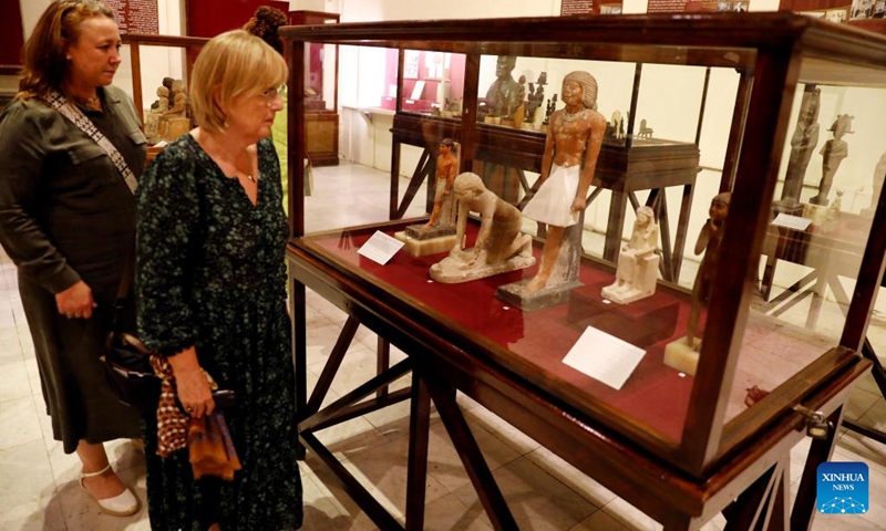 Visitors view ancient Egyptian statues during a temporary exhibition of antiquities at Egyptian Museum in Cairo, Egypt, on Sept. 27, 2022. The Egyptian Museum on Tuesday opened a temporary exhibition of antiquities to mark World Tourism Day, which coincides this year with the 200th anniversary of the creation of the field of Egyptology and the decoding of ancient hieroglyphs.(Photo: Xinhua)