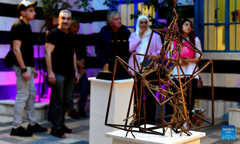 People visit a sculpture gallery in Damascus, Syria, Sept. 27, 2022.(Photo: Xinhua)