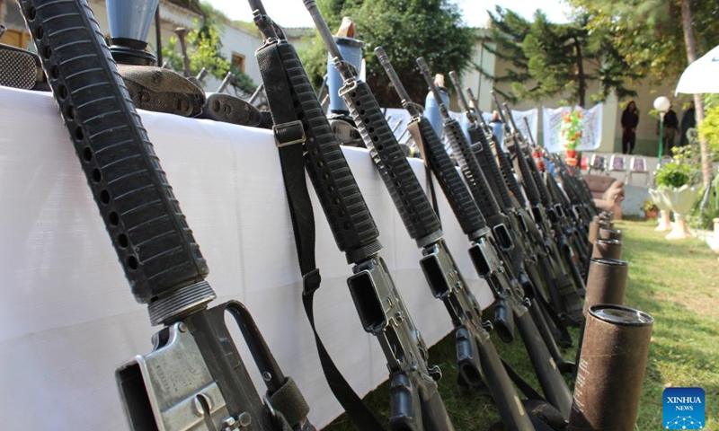 Photo taken on Sept. 25, 2022 shows the weapons seized by Afghan security forces in Kunar province, Afghanistan. The Afghan security forces have collected hundreds of pieces of weapons as locals willingly handed over their arms and ammunition to local authorities in Afghanistan's eastern Kunar province on Sunday.(Photo: Xinhua)