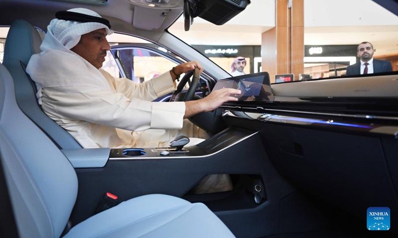 A man tries a car at an auto show of Chinese car brands in Hawalli Governorate, Kuwait, on Sept. 28, 2022.(Photo: Xinhua)