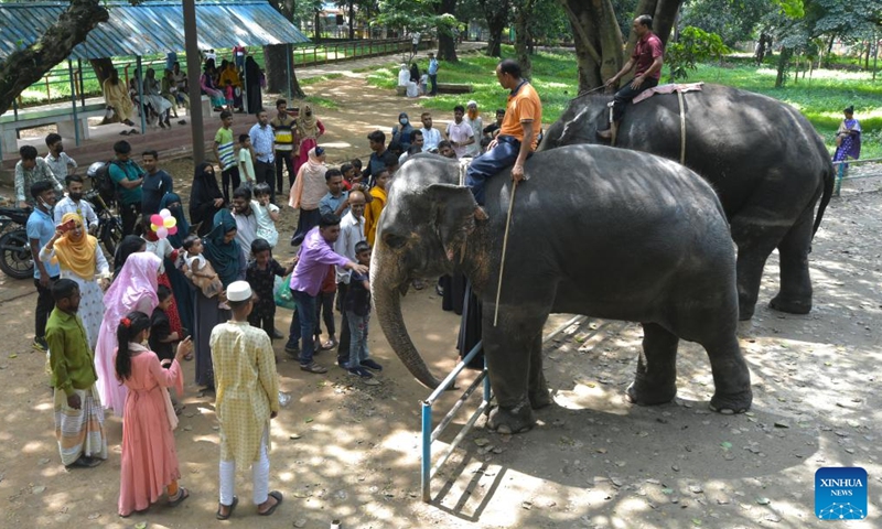 Visitors interact with elephants at the Bangladesh National Zoo in Dhaka, Bangladesh, on Oct. 4, 2022, the World Animal Day.Photo:Xinhua