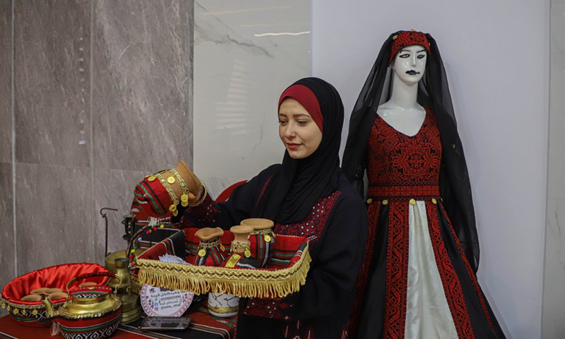 A woman participates in a festival held to celebrate Palestinian National Heritage Day, in Gaza City, Oct. 11, 2022. (Photo: Xinhua)